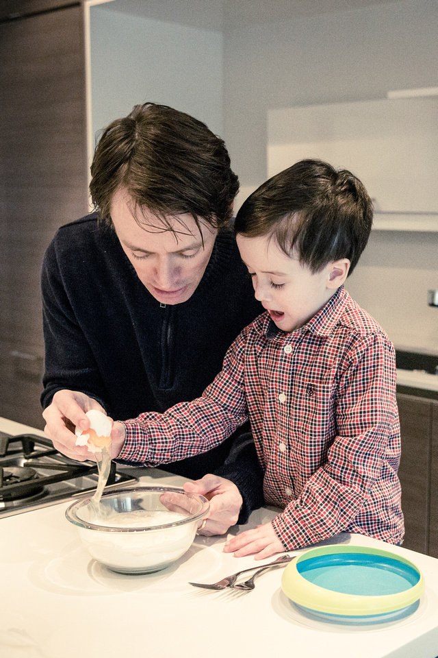 Father and son making pancakes