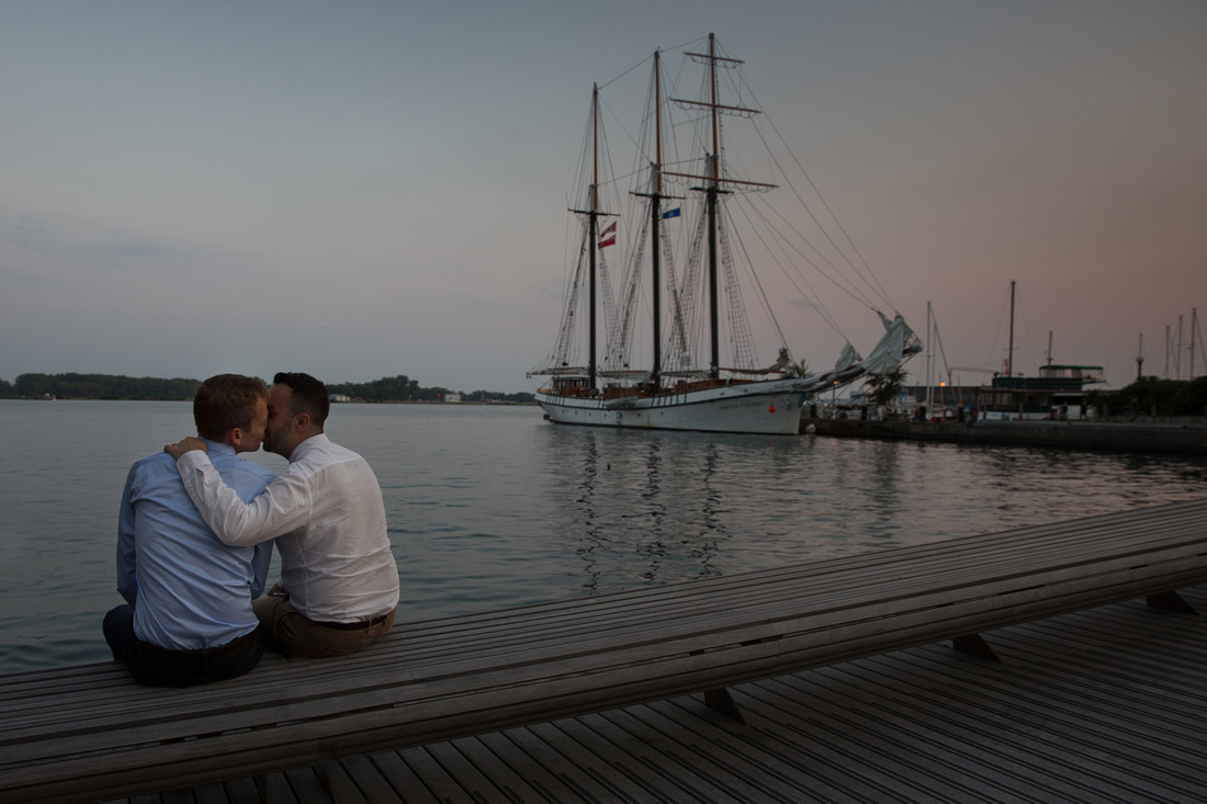 newly engaged couple at the spadina wave deck in toronto